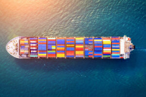 Cargo ship carrying export containers across the ocean – SJ EXIM SOLUTIONS global trade.