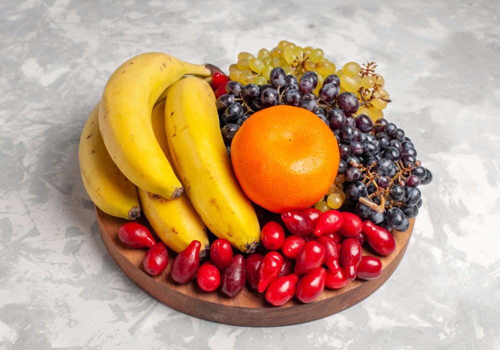 front-view-fruit-composition-bananas-dogwoods-grapes-white-surface-fruit-berry-freshness-composition-vitamine-color